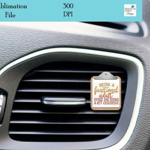 May include: A white car air freshener with a brown wooden frame and a silver clip. The air freshener has a white background with black text that reads "BEING A functional adult EVERY DAY SEEMS A BIT EXCESSIVE".