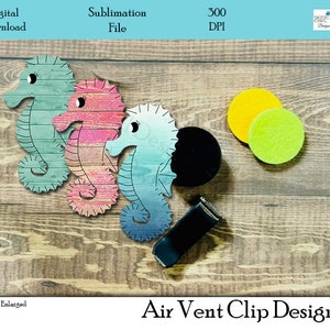 May include: Three sublimation designs of seahorses on a woodgrain background. The seahorses are in shades of blue, green, and pink. The designs are for air vent clips.  Air Vent Clip Design.