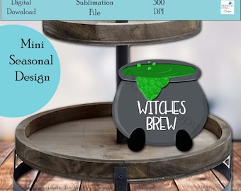 May include: A gray cauldron with green liquid and the text "WITCHES BREW" on a wooden tiered tray. This is a digital sublimation file for crafting.