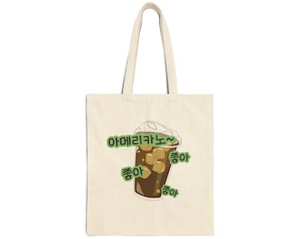 May include: A white tote bag with a cartoon illustration of a cup of iced coffee. The text on the bag reads "아메리카노~  좋아 좋아 좋아".