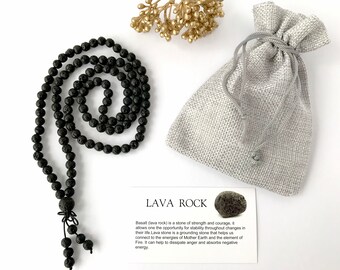 May include: A black lava rock beaded necklace with a small pouch and a card that reads "Lava Rock". Basalt (lava rock) is a stone of strength and courage, it allows one the opportunity for stability throughout changes in their life Lava stone is a grounding stone that helps us connect to the energies of Mother Earth and the element of Fire. It can help to dissipate anger and absorbs negative energy.