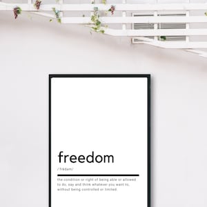 May include: Black and white typography print with the word "freedom" defined as "the condition or right of being able or allowed to do, say and think whatever you want to, without being controlled or limited."