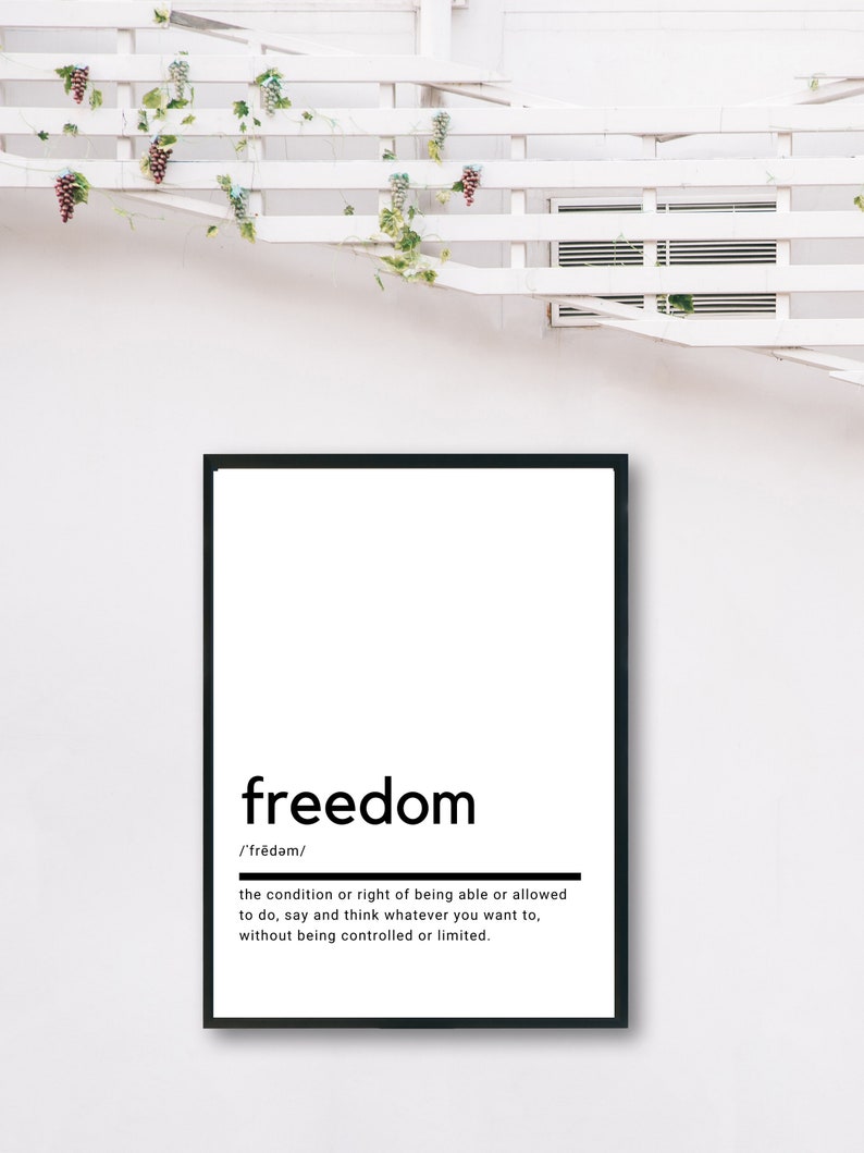 May include: Black and white typography print with the word "freedom" defined as "the condition or right of being able or allowed to do, say and think whatever you want to, without being controlled or limited."