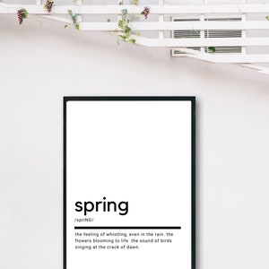 May include: A black and white printable wall art print with the word "spring" in bold, followed by the definition: "the feeling of whistling, even in the rain. the flowers blooming to life. the sound of birds singing at the crack of dawn."