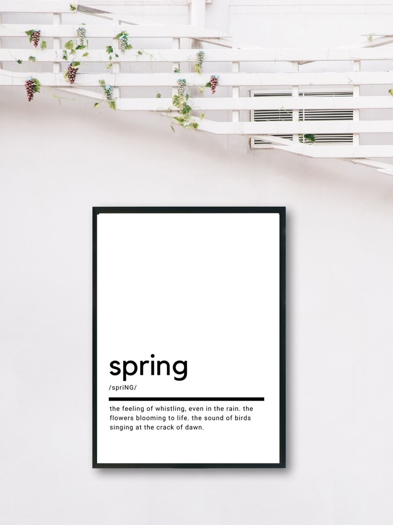 May include: A black and white printable wall art print with the word "spring" in bold, followed by the definition: "the feeling of whistling, even in the rain. the flowers blooming to life. the sound of birds singing at the crack of dawn."