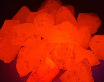 One Medium FLUORESCENT MANGANO CALCITE crystal from Peru. Manganese-bearing pink calcite.