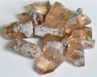 9 Piece lot of Imperial Topaz, Bixbyite, and rhyolite crystals from Utah. Terminated facet grade crystals.