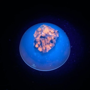 Fluorescent Sodalite in resin. Yellow Longwave Lw (365nm) Fluorescence.