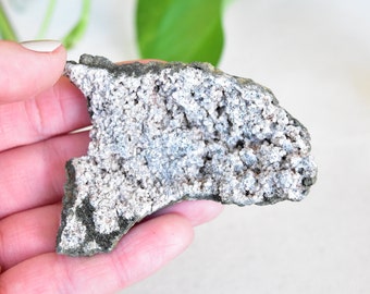 Prehnite with Pumpellyite. Green rough crystal. Paterson, New Jersey.