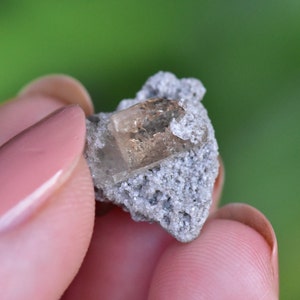 Imperial Topaz, Bixbyite, and Rhyolite crystals on matrix. From Utah.