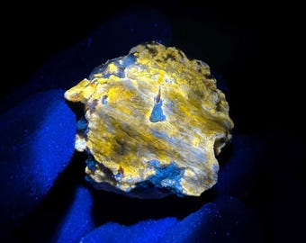 Fluorescent Scapolite, Rare Purple Diopside, and Calcite (Marialite/Meionite). Longwave fluorescence. From Rose Road, St Lawrence NY - ET132