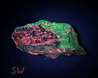 Fluorescent Crazy Calcite mineral specimen with minor sphalerite and willemite. Hamburg Mine, Franklin, New Jersey. Shortwave - ET130