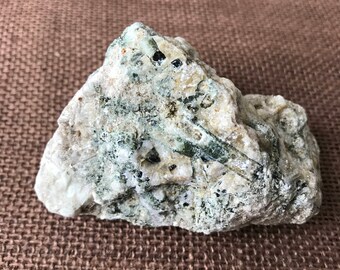 Green tourmaline on clear quartz. Medium size cabinet piece.