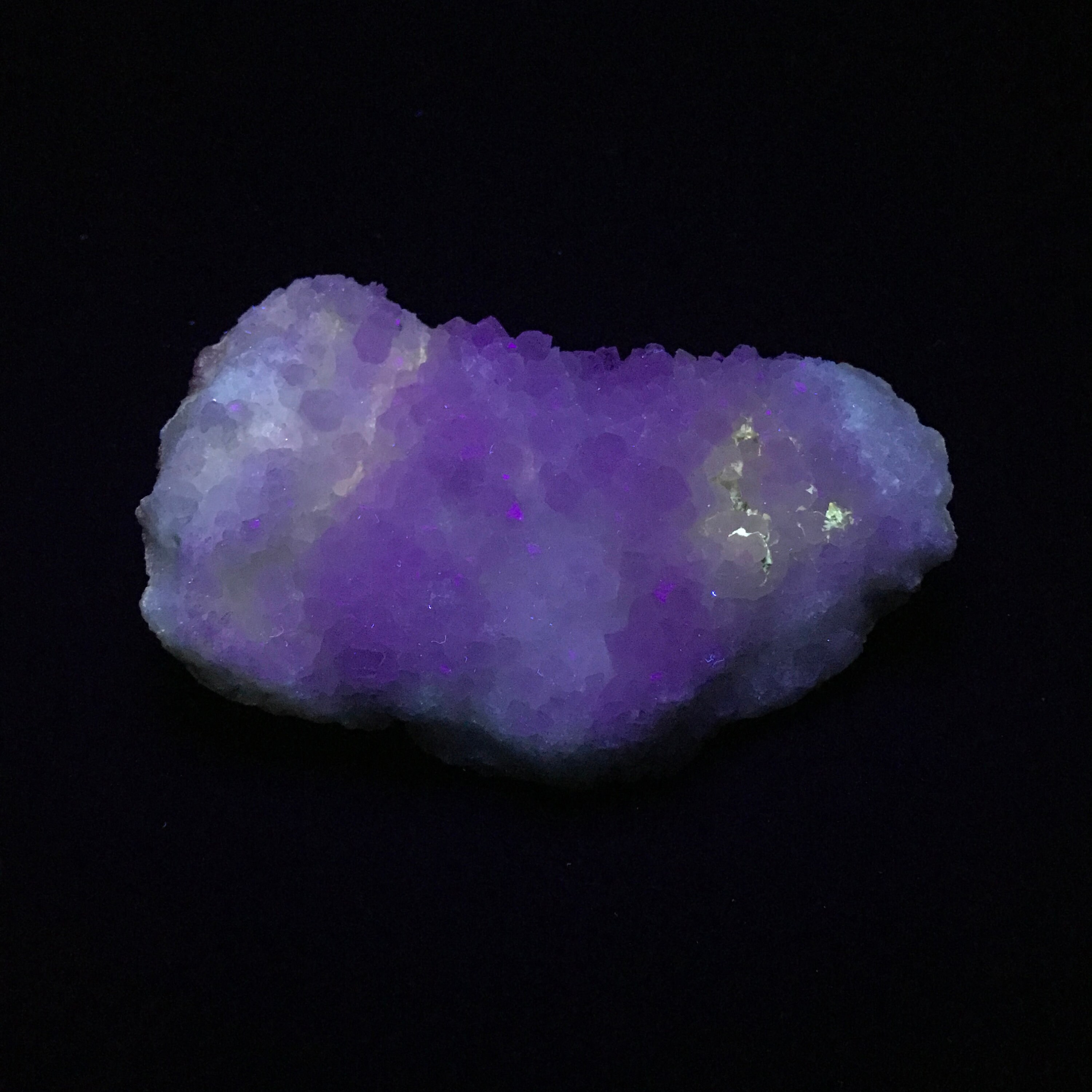 Geode quartz piece. The outside glows yellow under Shortwave and