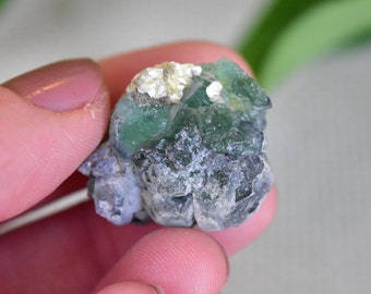 Fluorite Crystal with Some Hyalite Opal and Muscovite. Longwave, Shortwave, and Midwave UV FLuorescent. Erongo, Namibia