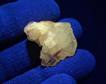FLUORESCENT CERUSSITE crystal from Touissit, Touissit-Bou Beker mining district, Morocco. Longwave LW (365nm) Uv Fluorescence