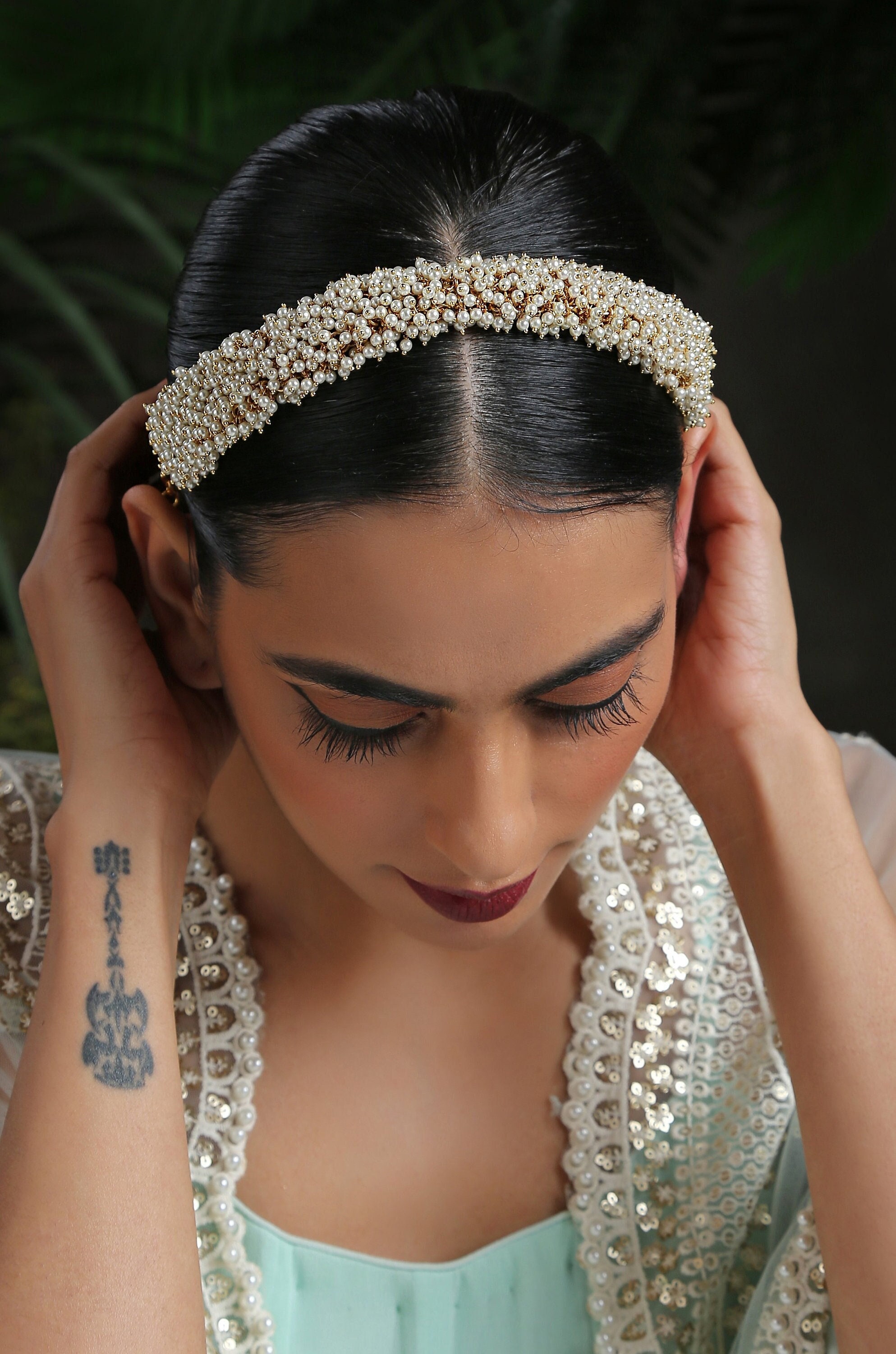 Photo of Bride wearing tiara style hair accessory with gown | Best bridal  makeup, Bridal hair, Floral hair