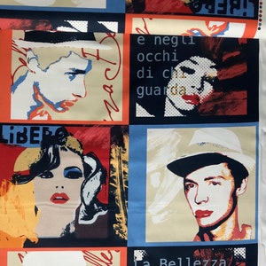 May include: A colorful fabric with a repeating pattern of portraits and text. The portraits are of people wearing hats. The text includes the words "La Bellezza" and "Libera".