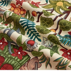 May include: A beige fabric with a colorful tropical print. The print features green leaves, red flowers, and yellow fruit. The fabric has a textured surface.