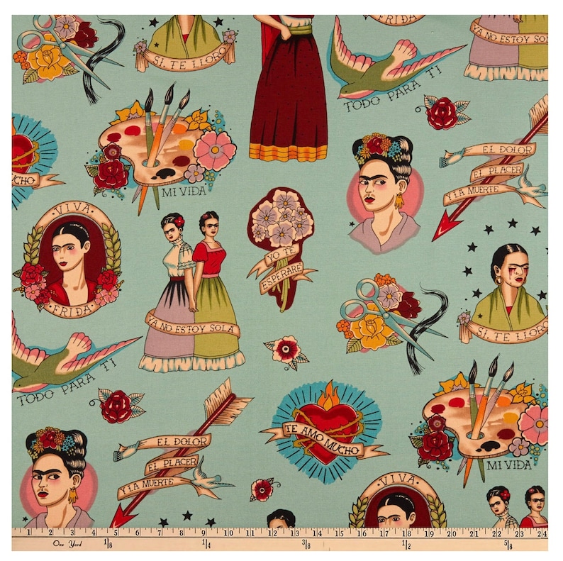 May include: Light blue fabric featuring Frida Kahlo-inspired illustrations. The design includes portraits, floral elements, paint palettes, scissors, arrows, and banners with Spanish text. The overall theme is artistic and cultural, with a vintage tattoo aesthetic.
