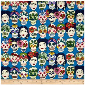 May include: A blue fabric with a repeating pattern of colorful sugar skulls with floral designs and the word "AMOR" on some of the skulls. The skulls are surrounded by flowers and hearts.