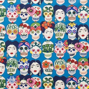 May include: A blue background with a repeating pattern of colorful sugar skulls with floral designs. The skulls have various facial expressions and some have the word "AMOR" written on their foreheads.