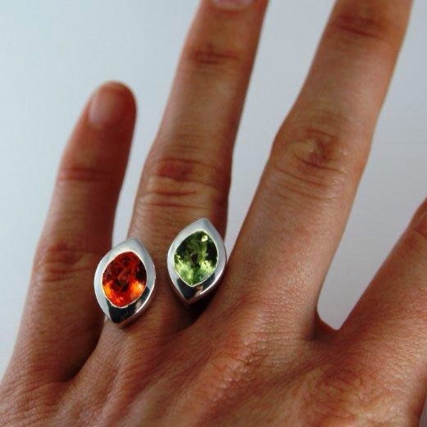 Bague argentée volante « Gemini » avec deux pierres semi-précieuses en forme de navette, invisibles entre vos doigts