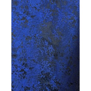 May include: A fabric textile featuring a vibrant royal blue base color with an intricate, abstract black pattern woven throughout. The material displays a subtle sheen and a textured, mottled appearance created by the contrasting dark shapes.