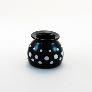 Miniature hand blown black and white glass vase