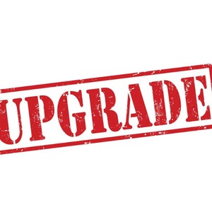 May include: A red rubber stamp with the word "UPGRADE" in white letters.