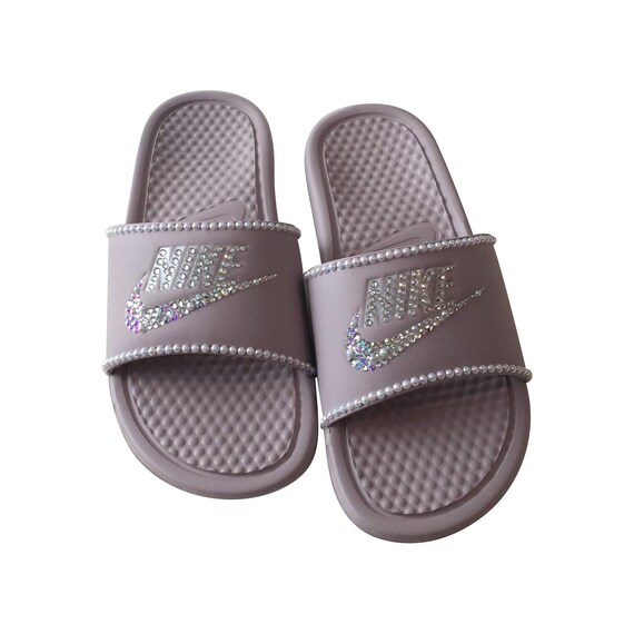 pink and silver nike slides