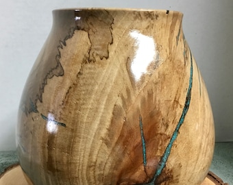 This is a Spalded Pecan bowl with Turquoise Inlay, it is 7 1/2” tall by 7” wide