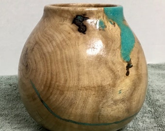 This is a piece of Hackberry wood with Turquoise Inlay, it is 5 3/4” tall by 5 3/4” wide