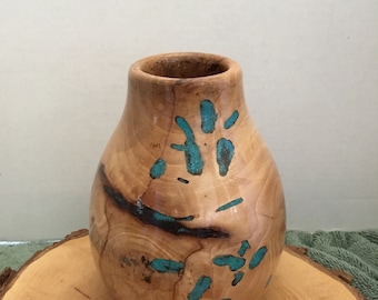 This is a Spalded wood Pecan bowl with Turquoise Inlay, it is 6 1/2”  tall by 5” wide