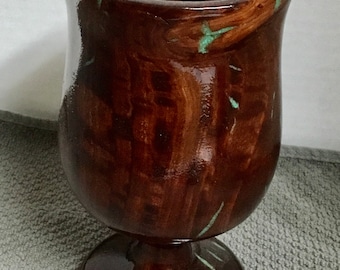 This is an eucalyptus vase with Turquoise Inlay, it is 6 1/2” tall by 3 1/4” wide