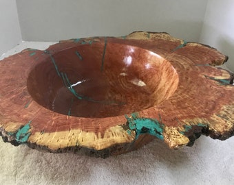 This is a Black locus Wood Burl with Turquoise inlay, it is 18” wide and 5” high.