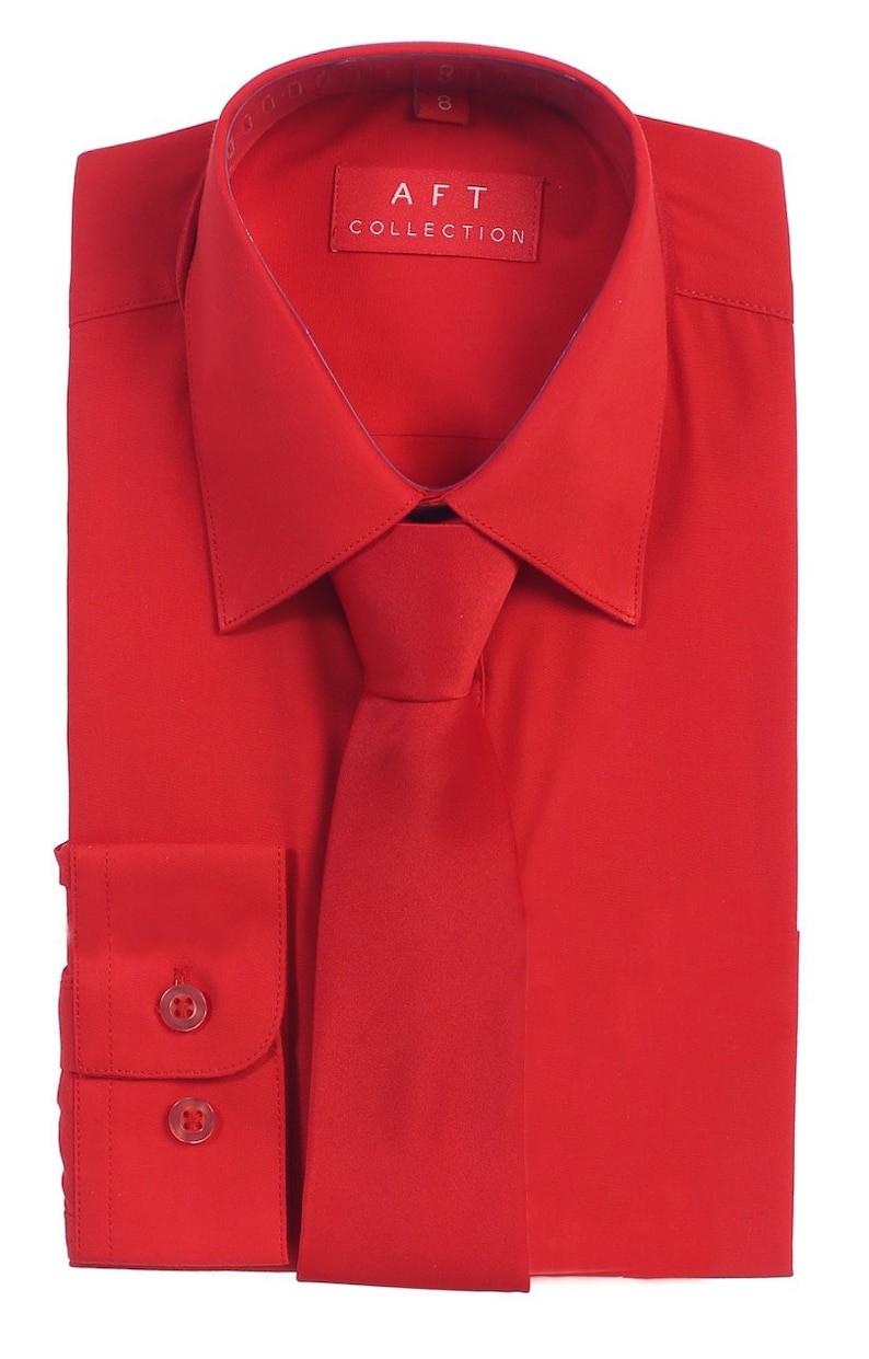 May include: A red dress shirt with a matching red tie. The shirt has a button-down collar and long sleeves. The label on the shirt reads "AFT COLLECTION".
