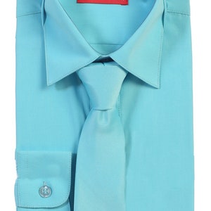 May include: A light blue dress shirt with a matching tie. The shirt has a button-down collar and long sleeves. The label on the shirt reads "AFT COLLECTION".