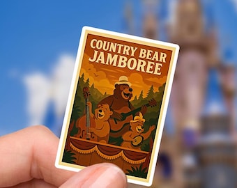 May include: A rectangular sticker with the text "COUNTRY BEAR JAMBOREE" features a cartoon illustration of three bears playing musical instruments in a boat. The background shows a sunset over a forest. The sticker is held in front of a blurred castle.