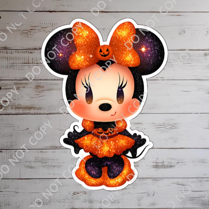 May include: A Halloween-themed Minnie Mouse sticker. The sticker features Minnie Mouse in a black and orange outfit with a pumpkin bow. The background of the ears has a galaxy design. The sticker is on a white wooden surface.