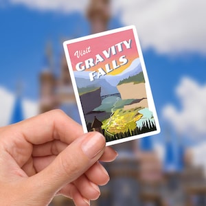 May include: A rectangular Gravity Falls sticker with a scenic landscape design. The sticker features the text "Visit Gravity Falls" in white and a colorful illustration of mountains, a bridge, and a sunset.