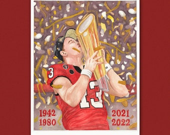 May include: Watercolor painting of a football player in a red jersey holding a gold trophy. The player is surrounded by confetti and the years 1942, 1980, 2021, and 2022 are written on the image. The text "IG: @LAURELS_LOIS | ETSY: ANNA LOIS CALLEN ART" is at the bottom of the image.
