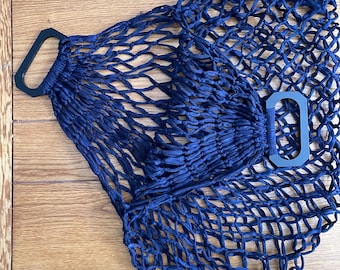 Bolsa de compras de los años 50 con asas de baquelita, tipo tote de mercado, tejida y expandible.