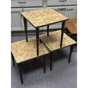 May include: A set of three ceramic mugs with a speckled, matte finish. Each mug features a different color: light blue, cream, and gray. The mugs have a simple, modern design, perfect for coffee or tea.