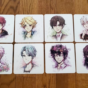 May include: Set of eight square coasters featuring anime-style illustrations of characters with different hair colors and styles. The characters are depicted with a watercolor background.