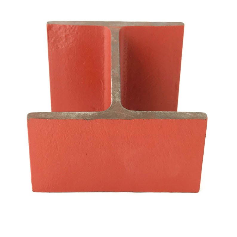 May include: A red metal I-beam with a T-shaped cross-section. The beam is painted a bright orange color.