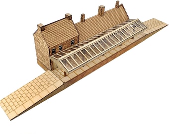 May include: A wooden model kit of a railway station with a glass roof. The kit is made of multiple materials and is for OO gauge. The kit is made in the UK.