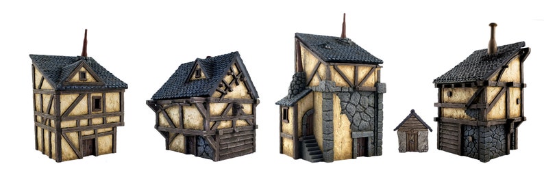 May include: Five miniature wooden houses with black roofs and stone accents. The houses are painted in shades of brown, beige, and gray. The houses are all different sizes and shapes, and they have various details, such as windows, doors, and chimneys.