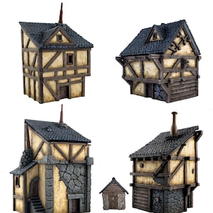 May include: Set of five miniature wooden houses with black roofs. The houses are painted in a light brown color with dark brown accents. The houses are all different sizes and shapes.
