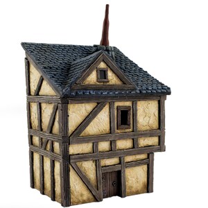 May include: A miniature model of a two-story building with a steeply pitched roof, a chimney, and a small door. The building is made of wood and painted in a light brown color with dark brown accents. The roof is painted a dark blue color.